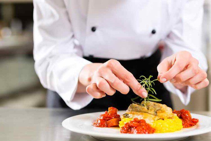 Jolanta plating a dish