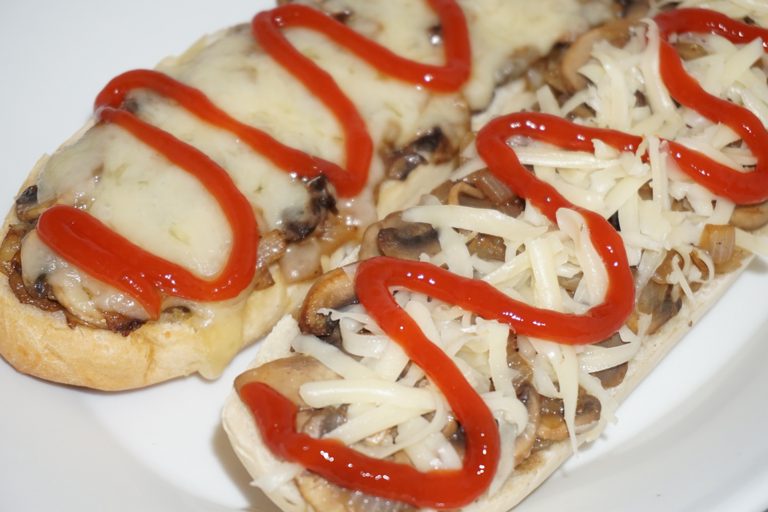 mushroom and salami cheese baguette — zapiekanka